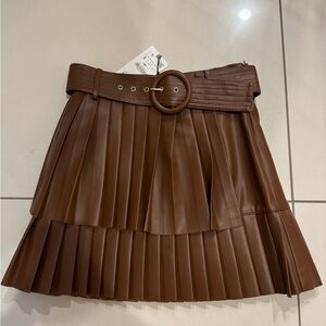 Pleather skirt never worn with belt.